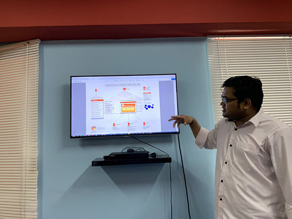 Man explaining blockchain on computer monitor